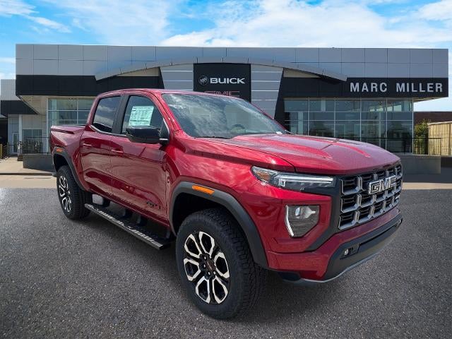 2026 GMC Canyon AT4 in Volcanic Red Tintcoat — front three-quarter view