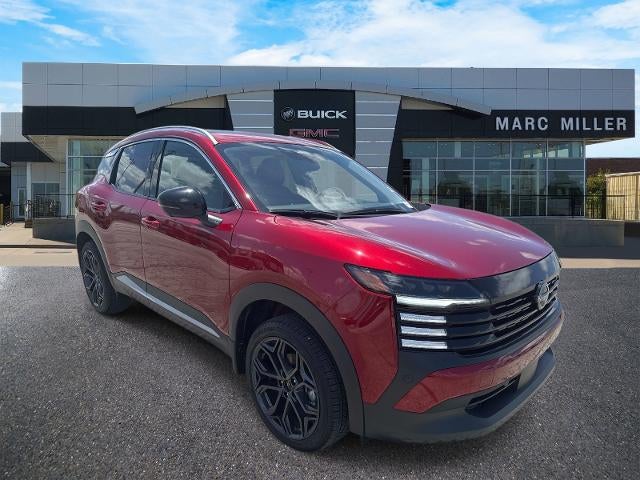 2026 Nissan Kicks SR in Scarlet Ember Tin — front three-quarter view